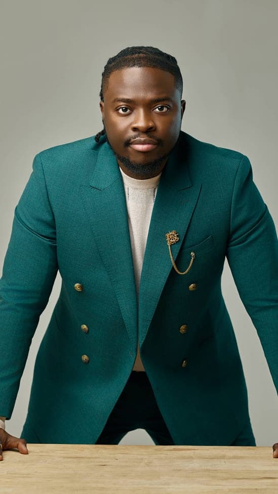 Idongesit Etukudo Isemin in a teal double-breasted suit